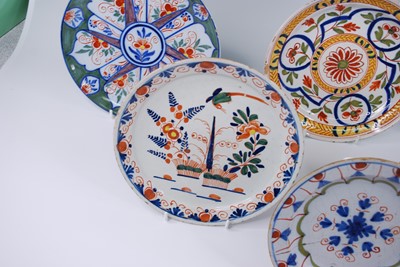 Lot 2143 - A collection of six Delft polychrome plates,...