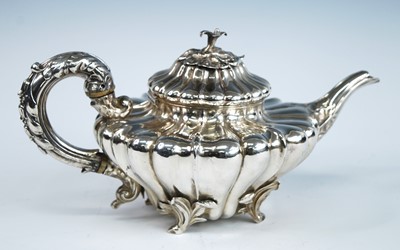 Lot 2276 - A George IV silver 'water-lily' teapot, of...