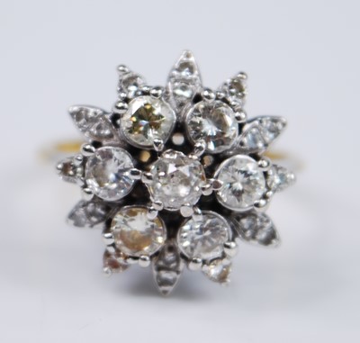 Lot 2387 - A yellow and white metal diamond flower shaped...