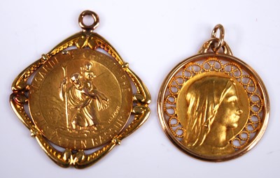 Lot 2335 - Two yellow metal pendants, comprising a St...