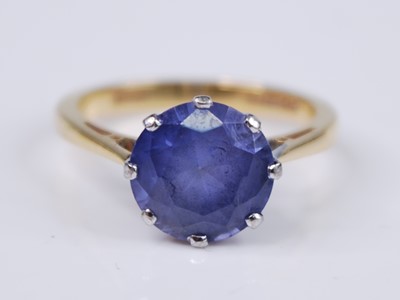 Lot 2344 - An 18ct yellow and white gold tanzanite single...