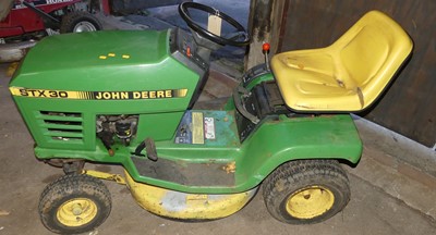 Lot 1191 - A John Deere STX30 petrol driven ride-on lawn...