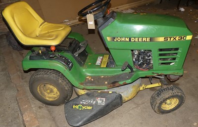 Lot 1191 - A John Deere STX30 petrol driven ride-on lawn...