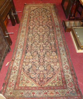 Lot 1194 - A Persian woollen hall runner, having...