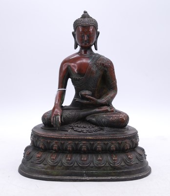 Lot 11 - A reproduction bronzed figure of a deity,...