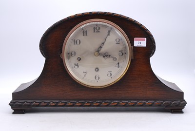 Lot 21 - An early 20th century oak cased mantel clock,...