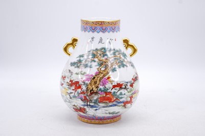Lot 24 - A Chinese porcelain vase, of Hu form, enamel...