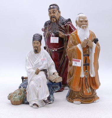 Lot 31 - Three Chinese 'mudman' style figures of...