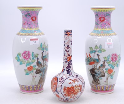 Lot 33 - A pair of Chinese Canton famille rose vases,...