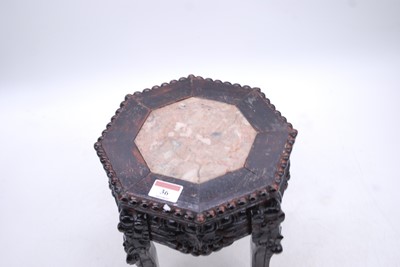 Lot 36 - A Chinese marble topped carved hardwood table,...