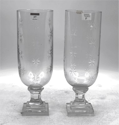 Lot 37 - A pair of cut glass hurricane lamps, h.34cm