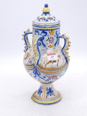 Lot 45 - A Spanish polychrome glazed earthenware urn,...