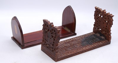 Lot 47 - An Anglo-Indian carved hardwood bookslide,...