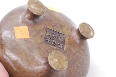 Lot 54 - A reproduction Chinese bronze tripod censor,...