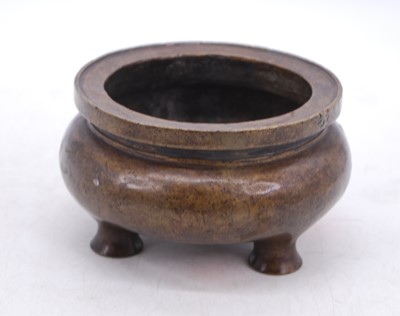 Lot 54 - A reproduction Chinese bronze tripod censor,...