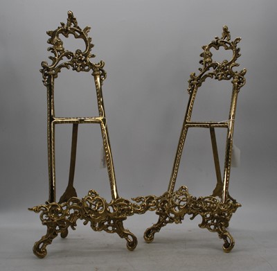 Lot 90 - A pair of brass table easels, in the Rococo...