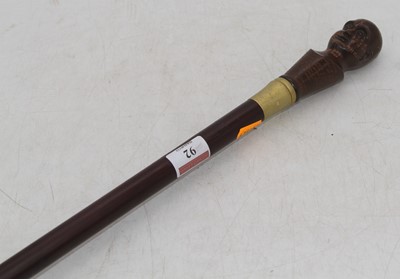Lot 92 - A modern walking stick, having a resin...
