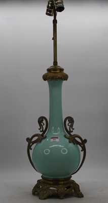 Lot 95 - A pair of Chinese celadon glazed table lamps,...