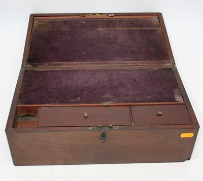 Lot 99 - A 19th century mahogany writing slope, the lid...