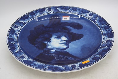 Lot 111 - A 20th century Delft charger, decorated with a...