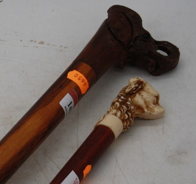 Lot 143 - An African carved hardwood walking stick, the...