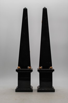 Lot 144 - A pair of polished black slate obelisks, each...