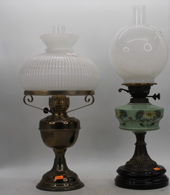 Lot 149 - A 19th century brass oil lamp, the milk glass...