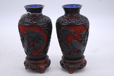 Lot 179 - A pair of Chinese cinnibar type vases, each...