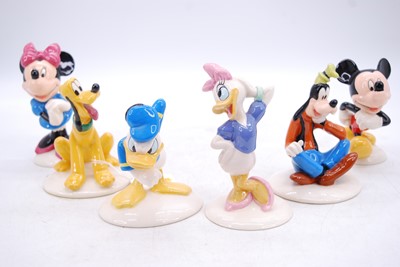 Lot 198 - A set of four Royal Doulton Mickey Mouse...