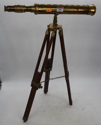 Lot 101 - A brass telescope, mounted upon a hardwood...