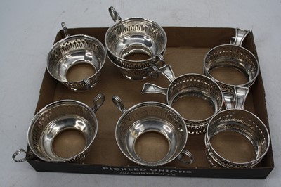 Lot 259 - A set of five pierced sterling silver mounts,...