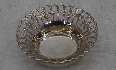 Lot 264 - A pierced white metal dish, repousse decorated...