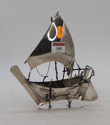 Lot 305 - An Arabian white metal model of a dhow boat,...