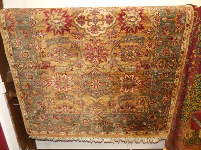 Lot 1201 - A Persian style floral decorated woollen rug,...