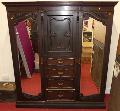 Lot 1204 - An Edwardian mahogany triple wardrobe, having...