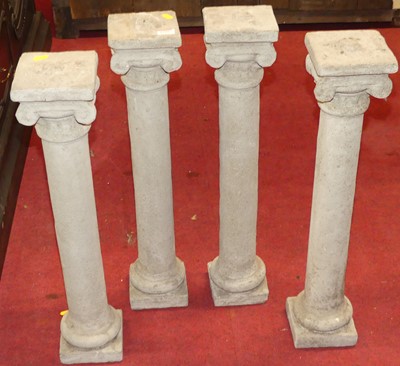 Lot 1206 - A set of four reconstituted stone Ionic...