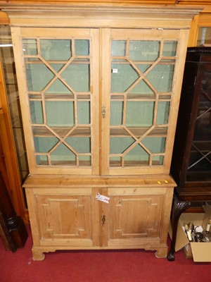 Lot 1221 - A 19th century pine bookcase cupboard, having...