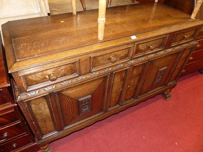 Lot 1248 - A 1930s geometric moulded oak double door...