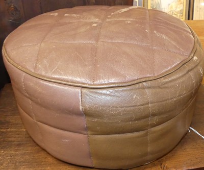 Lot 1253 - A 1960s Danish tan leather circular footstool,...