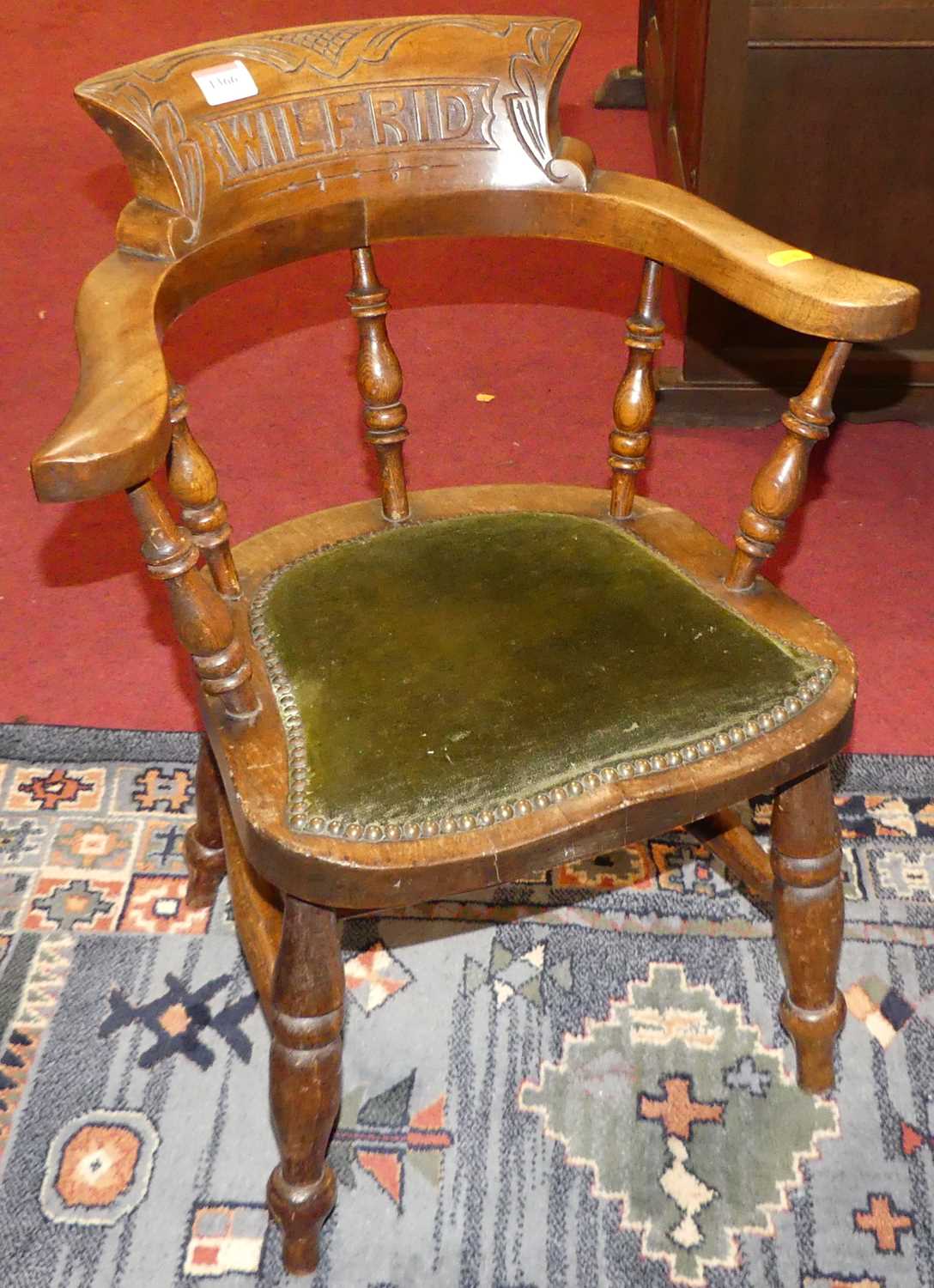 Lot 1366 - A circa 1900 child's walnut captain's chair,...