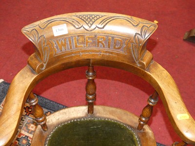 Lot 1366 - A circa 1900 child's walnut captain's chair,...