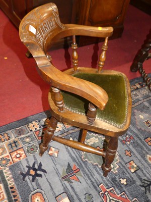 Lot 1366 - A circa 1900 child's walnut captain's chair,...