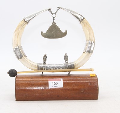 Lot 463 - An Eastern boar's tusk and white metal table...