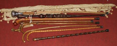 Lot 497 - A collection of vintage walking sticks