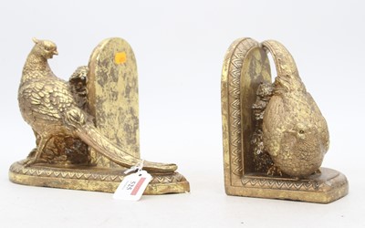 Lot 525 - A pair of reproduction gilt book-ends, each in...