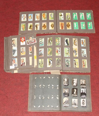 Lot 535 - A collection of cigarette cards, to include...