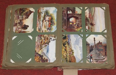 Lot 541 - A vintage postcard album, mainly containing...