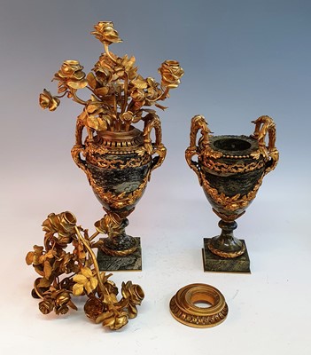 Lot 146 - A pair of polished green hardstone and gilt...