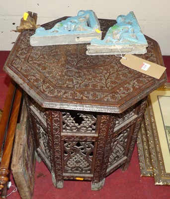 Lot 1119 - A Moorish carved hardwood octagonal occasional...