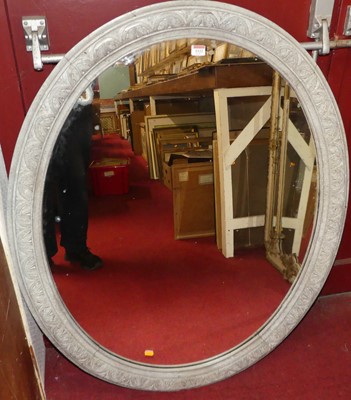 Lot 1122 - A painted and moulded wooden oval wall mirror,...